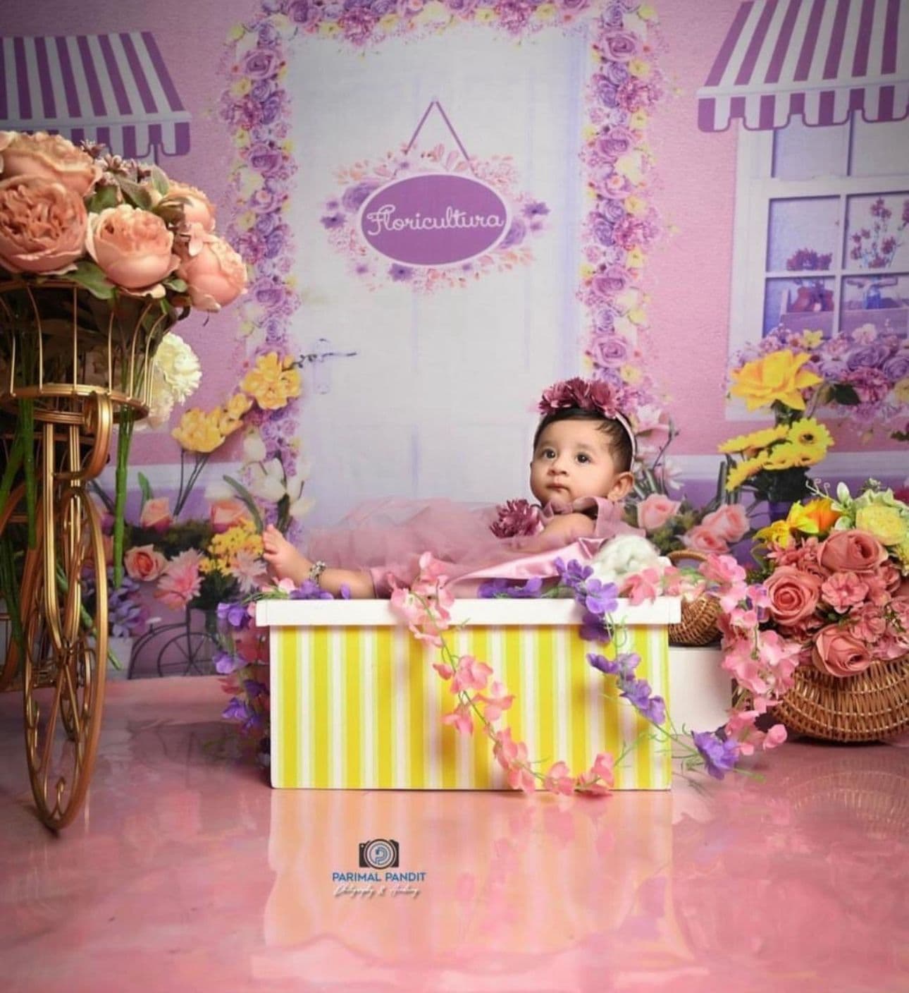 Baby milestone portrait with expressive eye contact at IBS Baby Photoshoot studio in Karvenagar, Pune