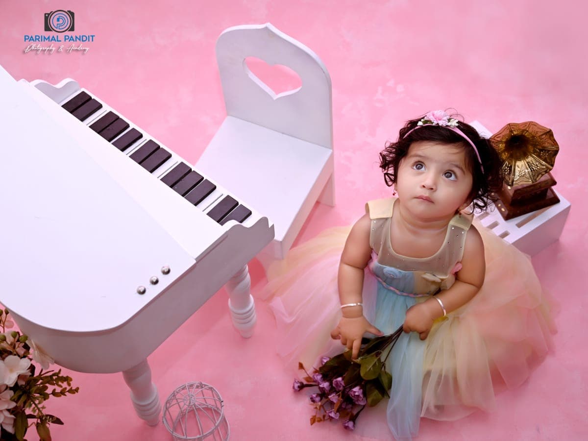 Baby sitting portrait with studio theme details at IBS Baby Photoshoot studio in Karvenagar, Pune